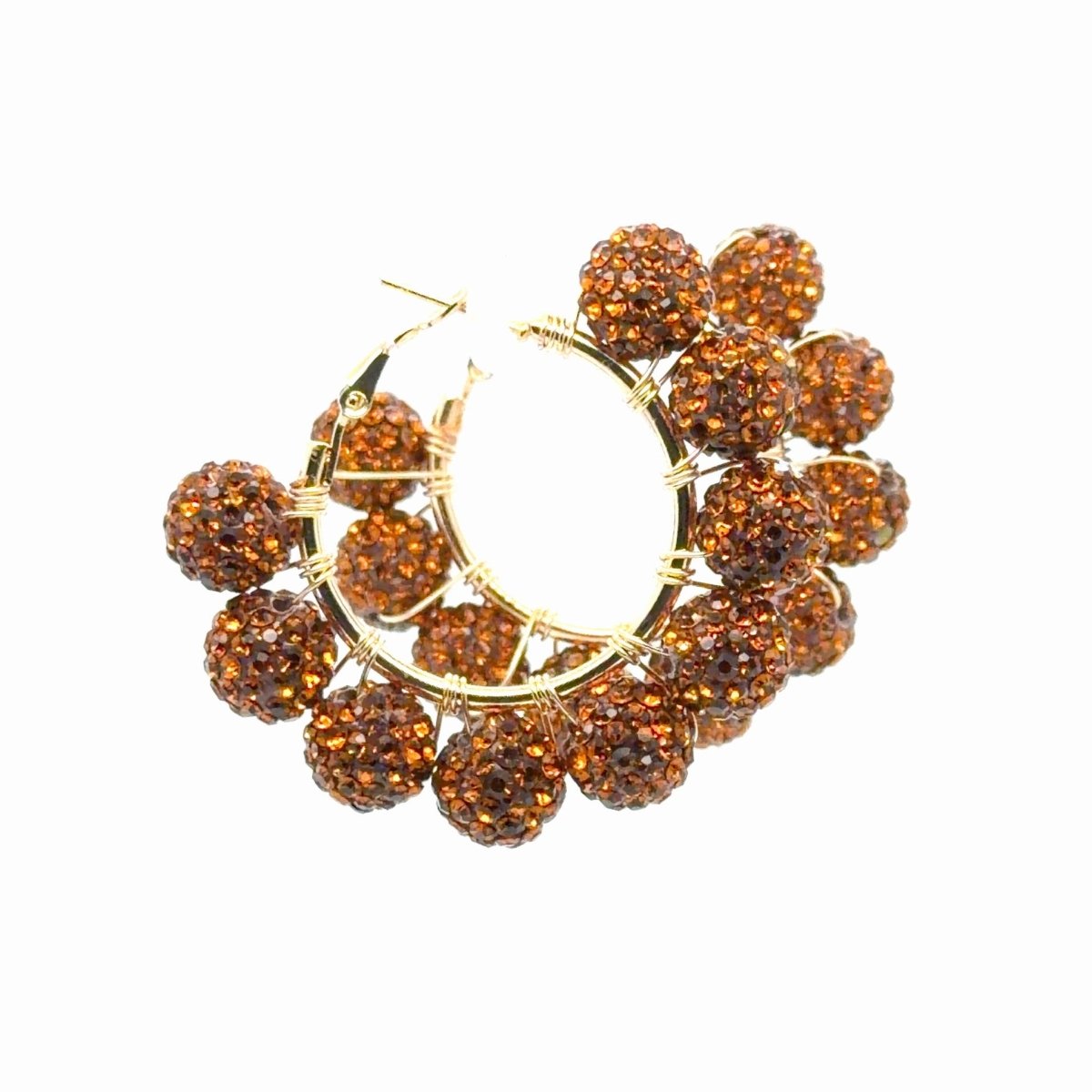 A pair of gold hoop earrings adorned with multiple textured, faceted amber-brown beads, shown against a plain white background.
