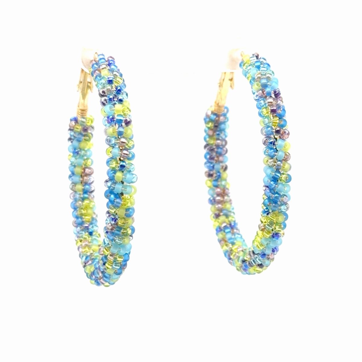 A pair of gold hoop earrings wrapped in small blue, yellow, and purple beads, shown against a plain white background.