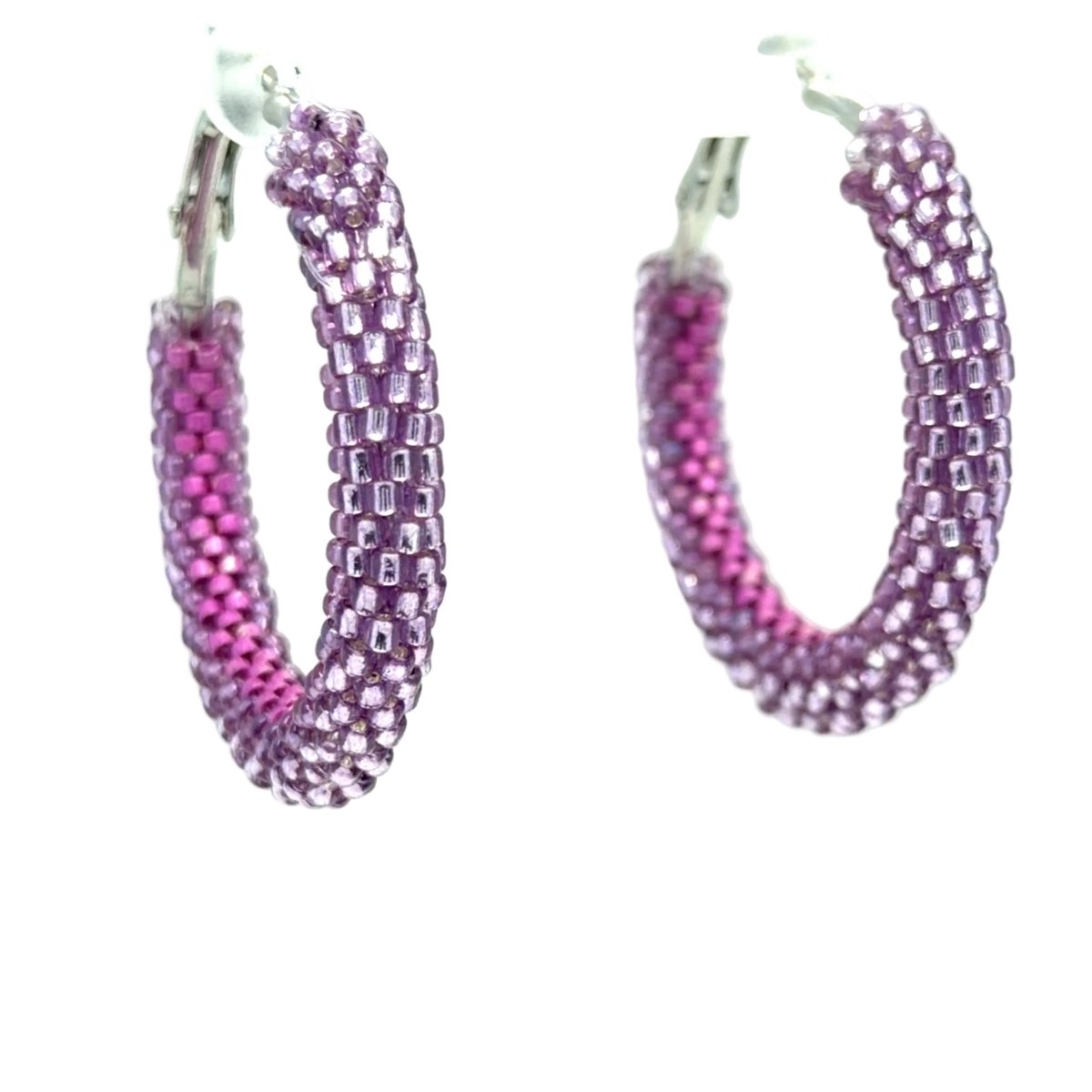 A pair of handmade hoop earrings made from small seed beads, featuring a silver-tone metal clasp and a color-changing design that shifts from lavender purple to bright magenta pink.