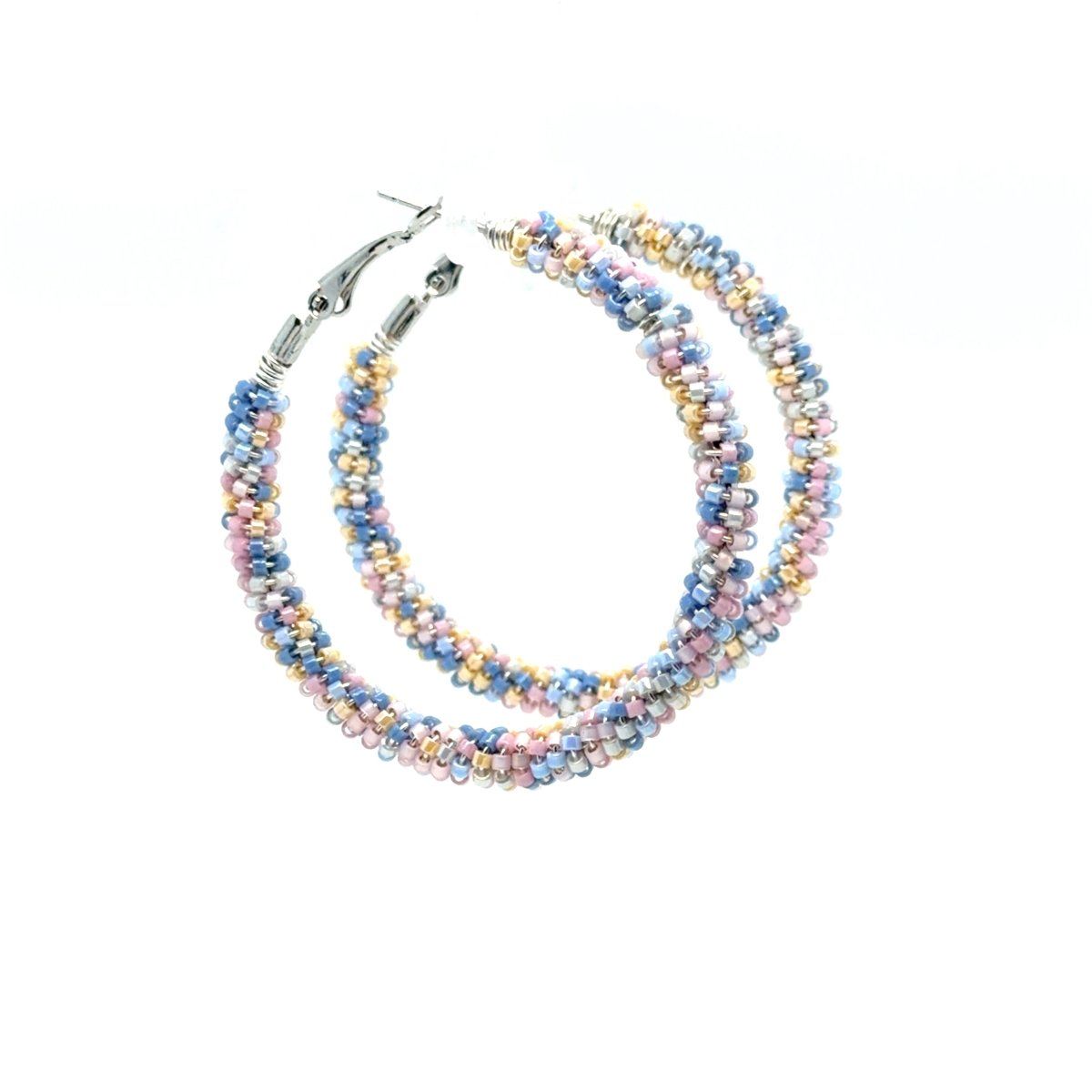 A pair of large hoop earrings made of tightly wound multi-strand beads in pastel shades of blue, pink, yellow, and white, with silver-tone metal clasps, shown on a plain white background.
